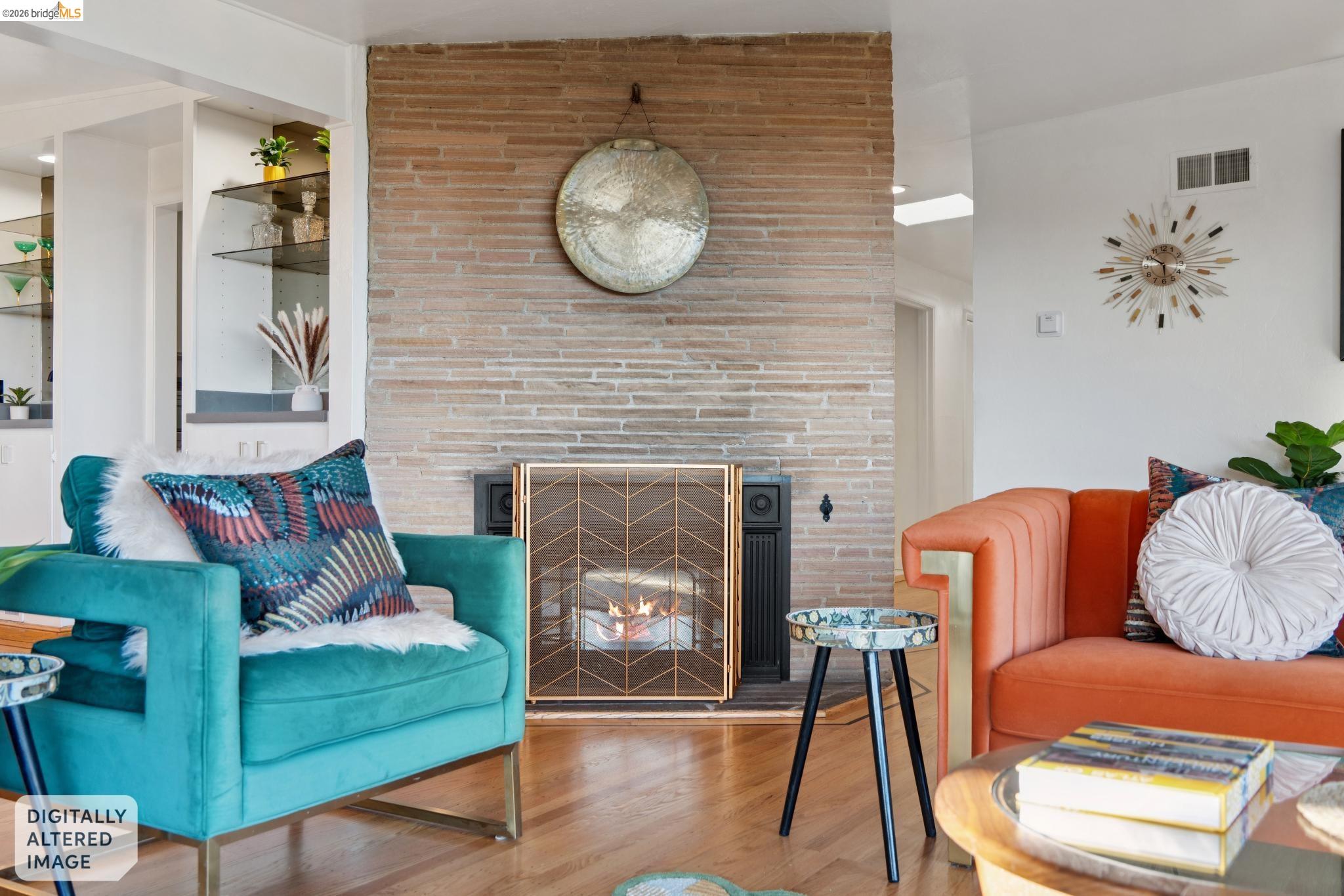 2301 Oak Street Berkeley, CA 94708 - Photo 3 of 61 Living area featuring a floor-to-ceiling brick fireplace with a decorative metal screen