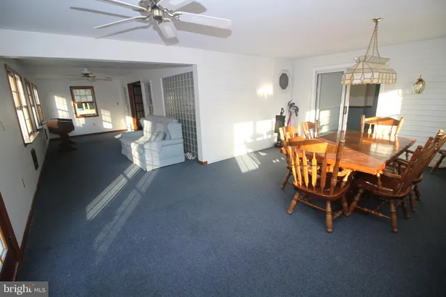 a dining room with furniture and window