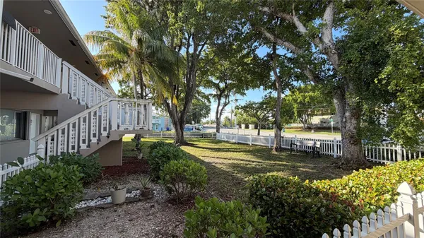 a view of a backyard with pathway