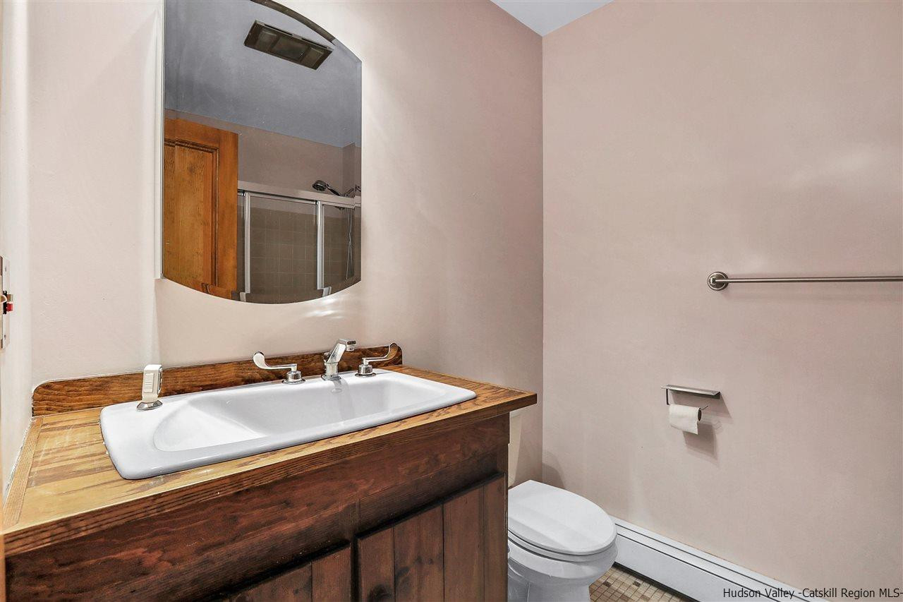 156 Sparkling Ridge Road New Paltz, NY 12561 - Photo 11 of 35 a bathroom with a sink toilet and a mirror