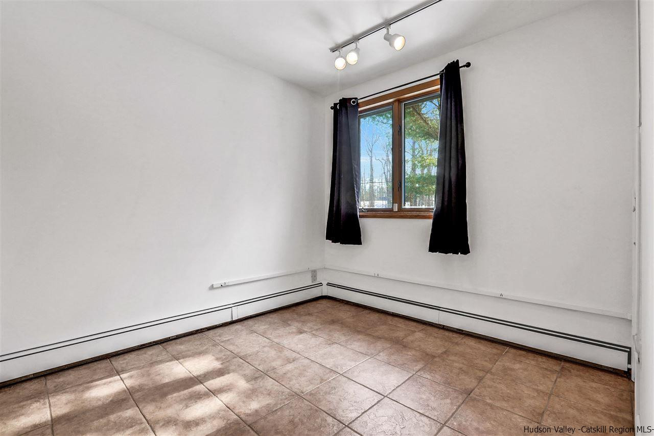 156 Sparkling Ridge Road New Paltz, NY 12561 - Photo 13 of 35 an empty room with windows