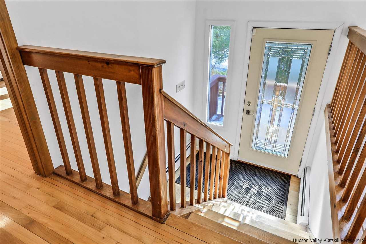 156 Sparkling Ridge Road New Paltz, NY 12561 - Photo 16 of 35 a view of a porch with wooden floor and staircase