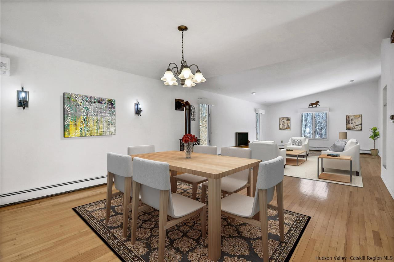 156 Sparkling Ridge Road New Paltz, NY 12561 - Photo 30 of 35 a view of a dining room with furniture and wooden floor