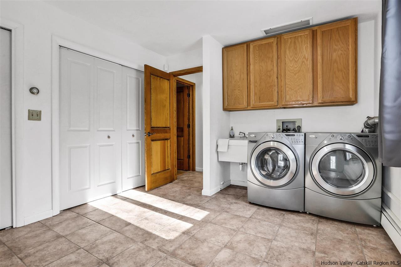 156 Sparkling Ridge Road New Paltz, NY 12561 - Photo 7 of 35 a view of a storage & utility room with washer and dryer
