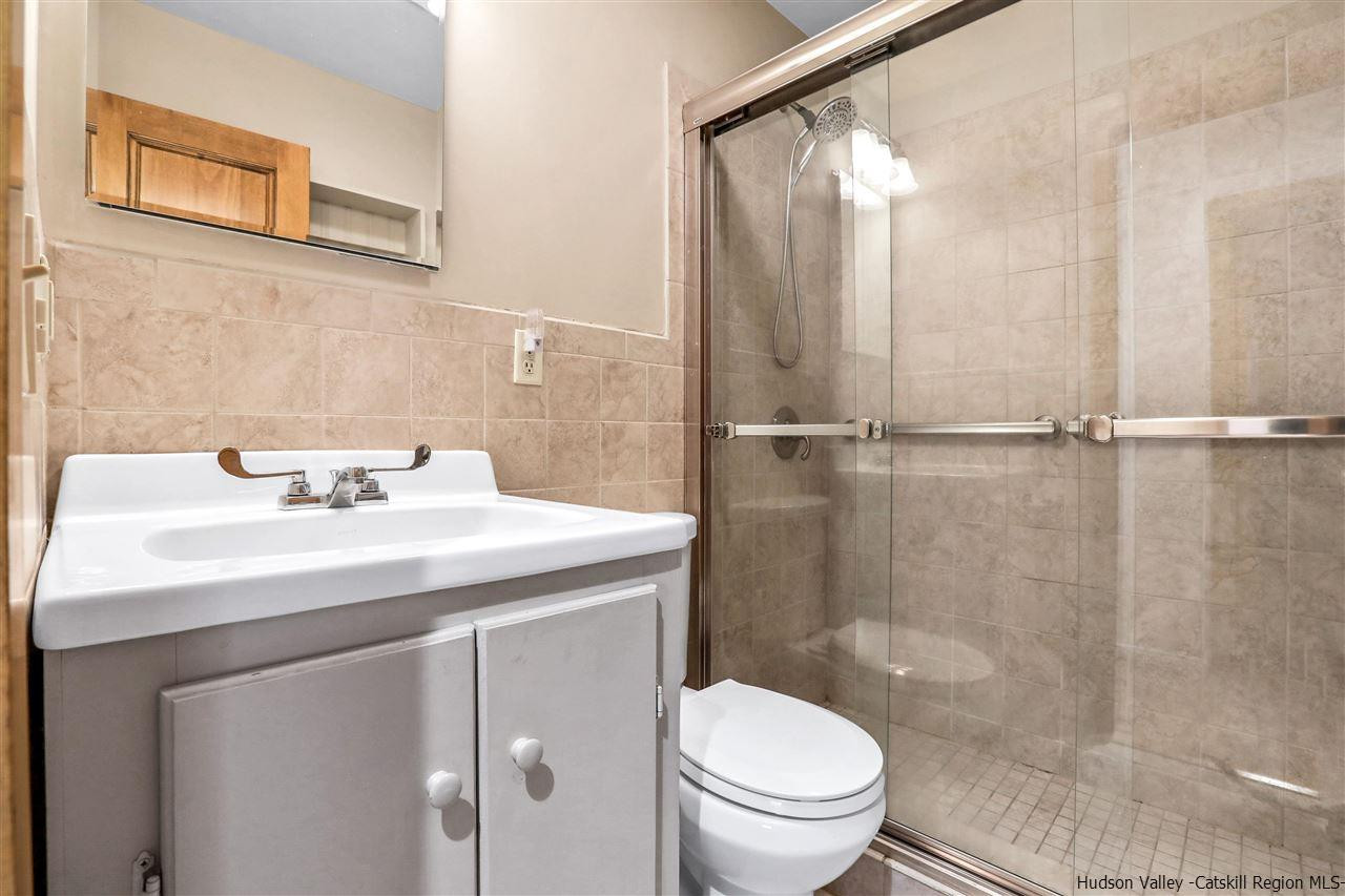 156 Sparkling Ridge Road New Paltz, NY 12561 - Photo 8 of 35 a bathroom with a sink a toilet and shower