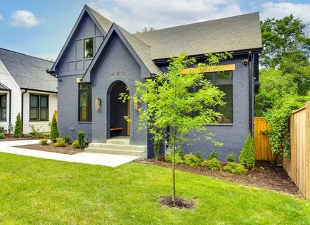 a front view of a house with garden