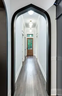 a view of a hallway view with wooden floor