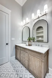 a bathroom with a double vanity sink and a mirror