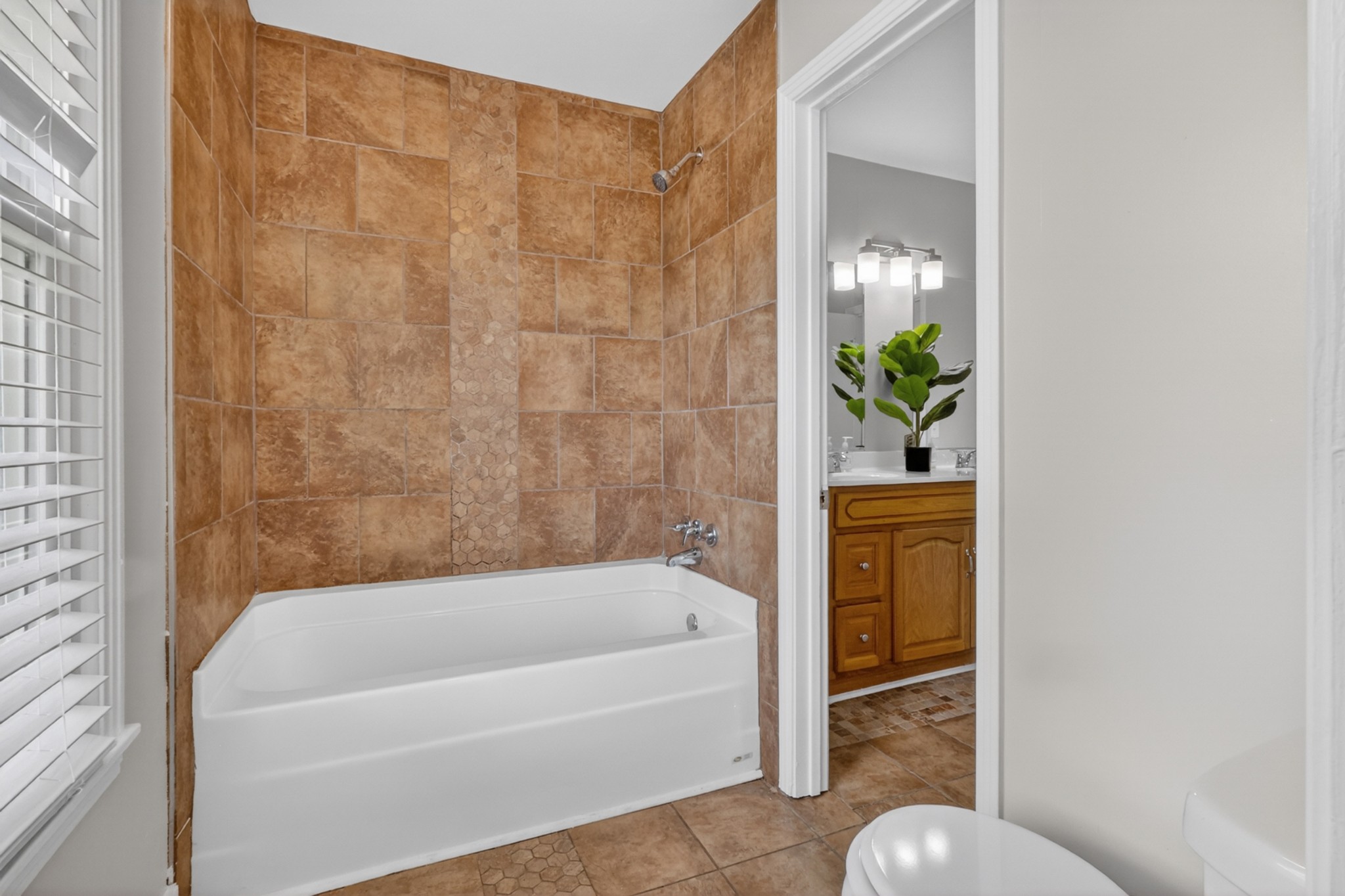 489 Canton Pass Madison, TN 37115 - Photo 15 of 25 a bathroom with a bathtub and shower