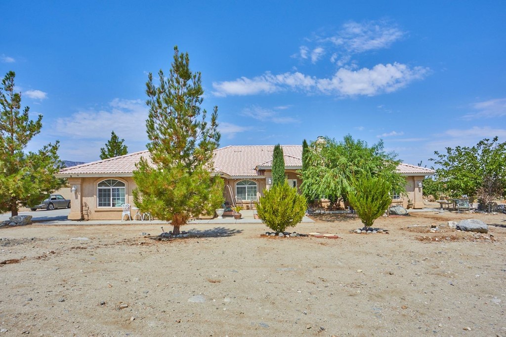 11176 Arena Road Pinon Hills, CA 92372 - Photo 1 of 1 front view of a house with a garden