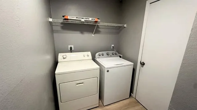a utility room with dryer and washer