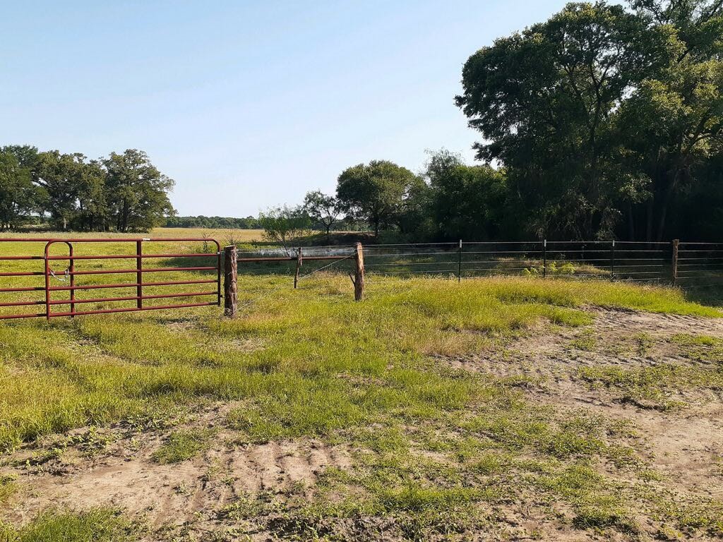 245 Rd Kosse Tx 76653 Road Kosse, TX 76653 - Photo 4 of 26 a view of a swimming pool with a bench
