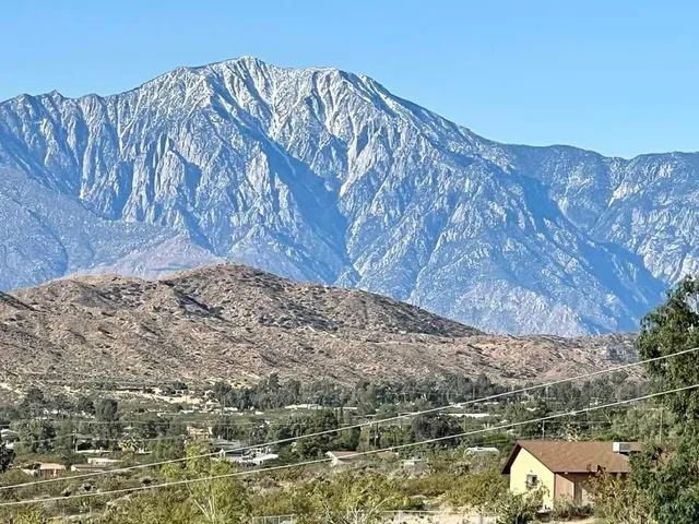 a view of a large body of water and mountain
