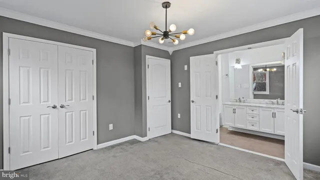 a view of a hallway with chandelier