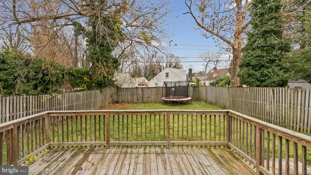 a balcony with view of trees in the background