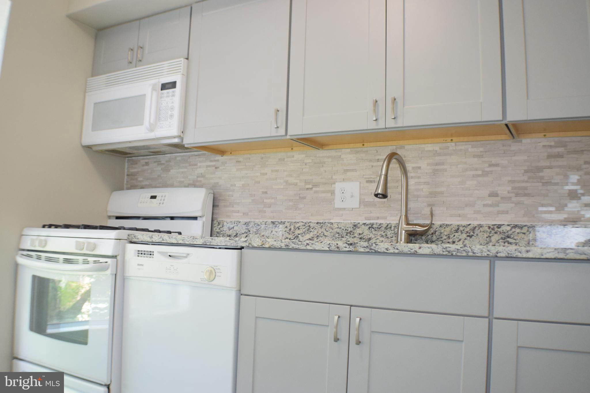 3952 Bel Pre Road, Unit 7 Silver Spring, MD 20906 - Photo 6 of 27 Kitchen (with microwave and stove)
