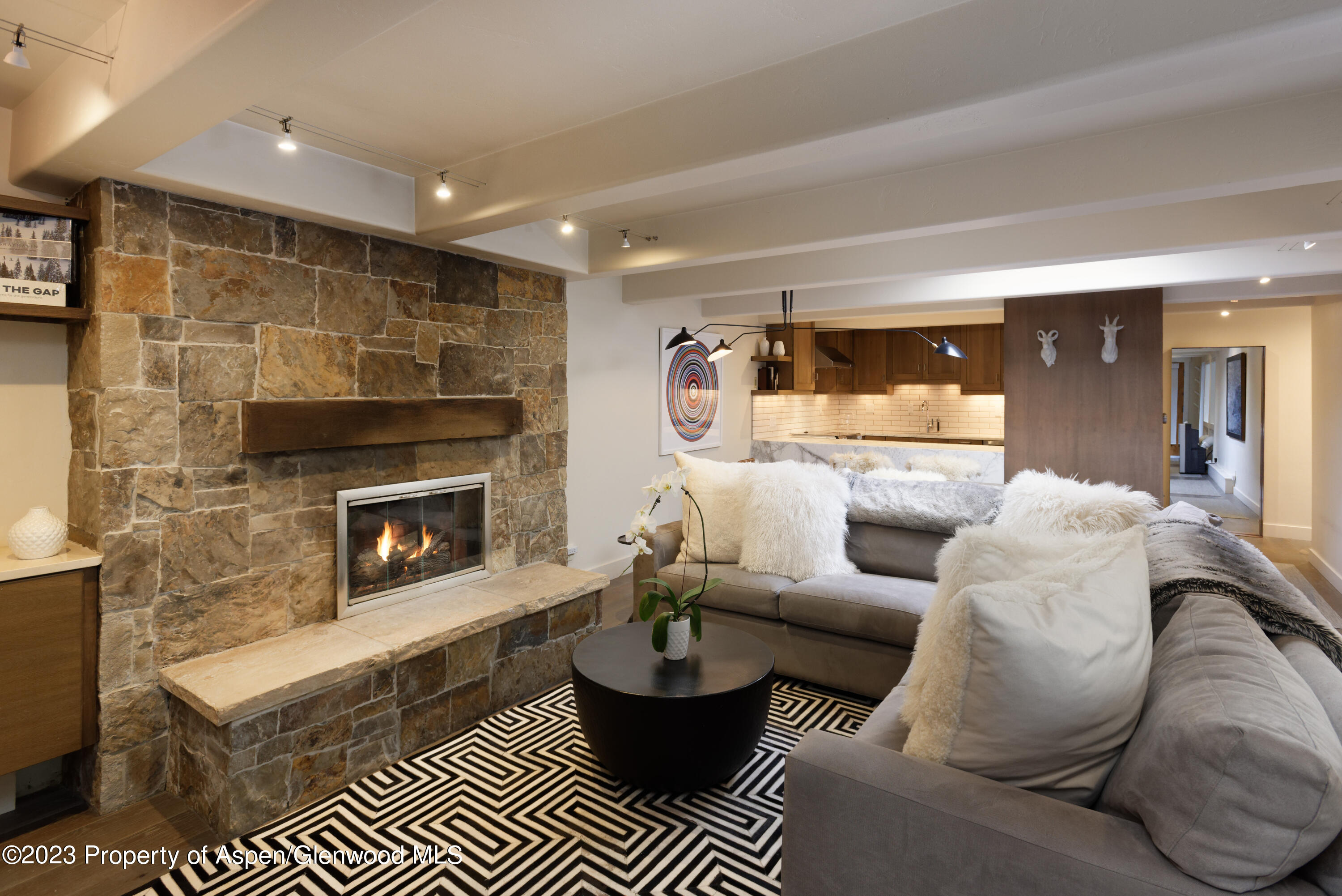 a living room with a couch and a fireplace