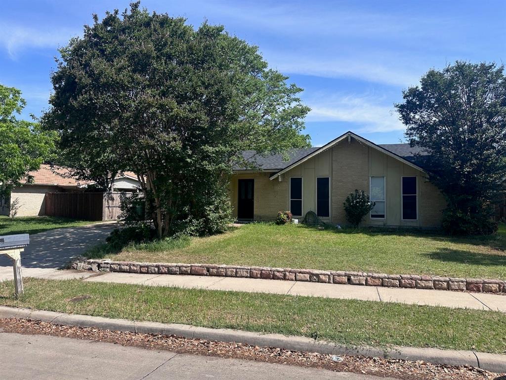 2103 Carlton Road Carrollton, TX 75007 - Photo 1 of 18 a front view of a house with a yard