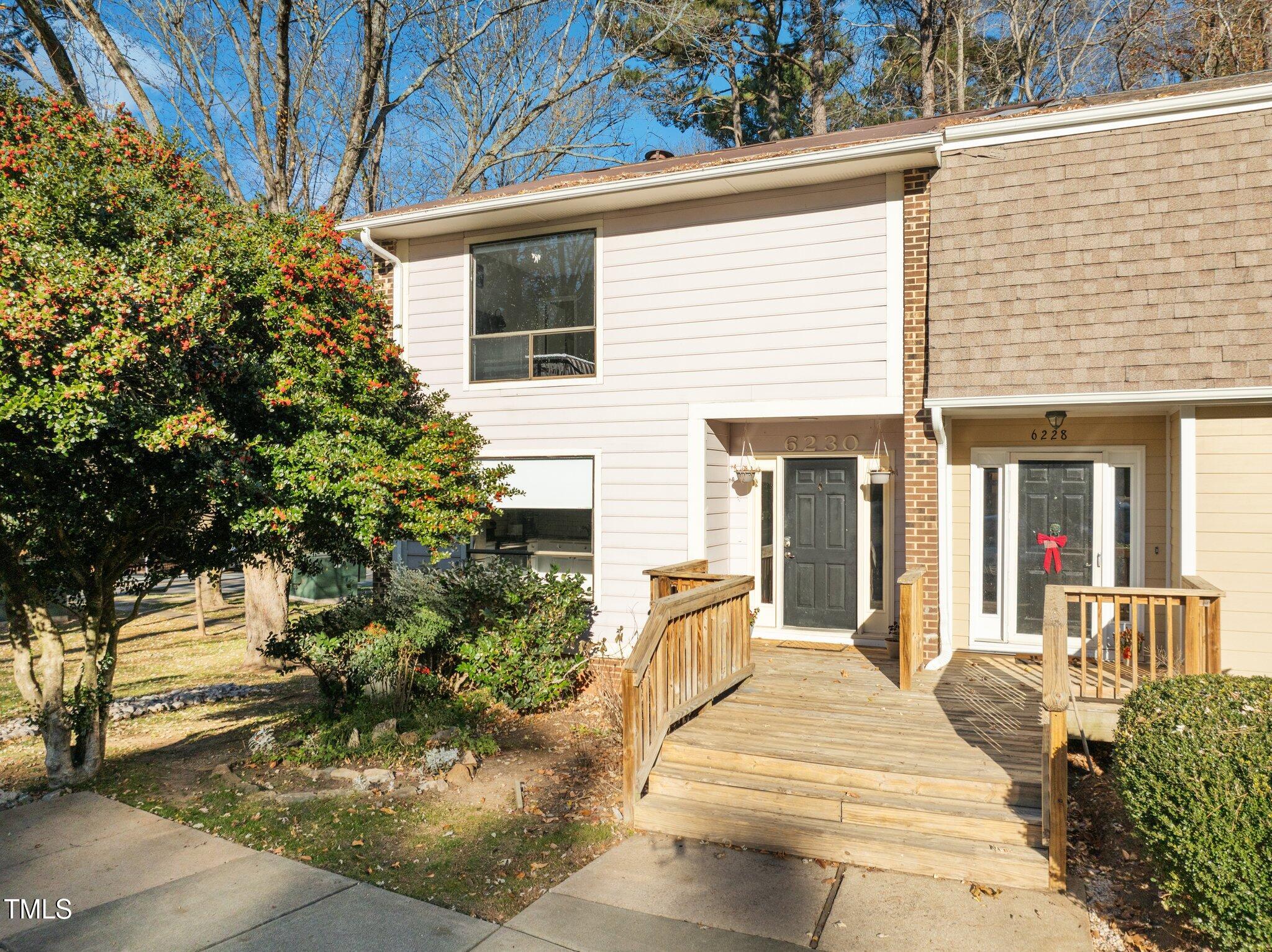 6230 Dixon Drive Raleigh, NC 27609 - Photo 1 of 32 a front view of a house with a porch