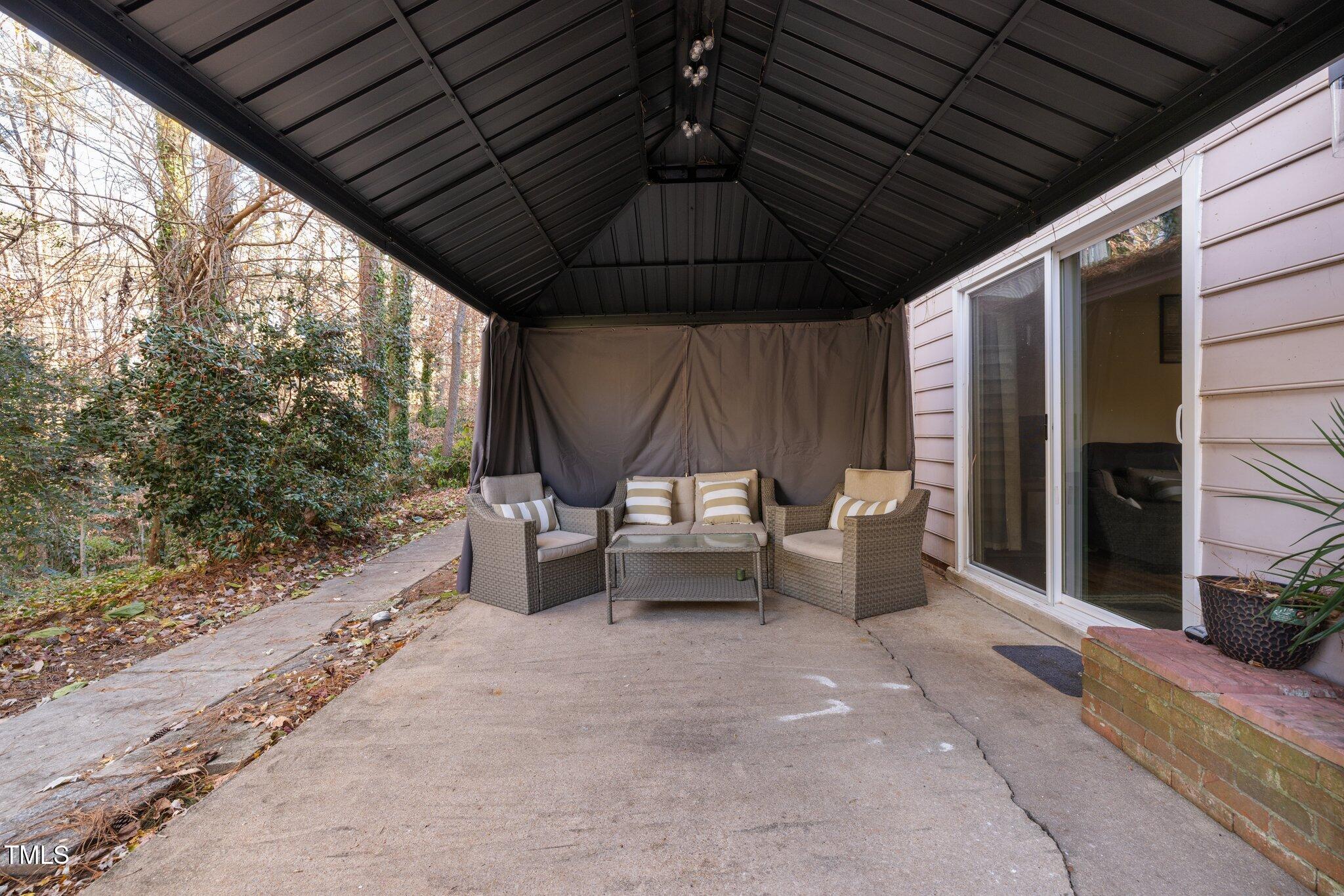 6230 Dixon Drive Raleigh, NC 27609 - Photo 19 of 32 a roof deck with couch and chairs