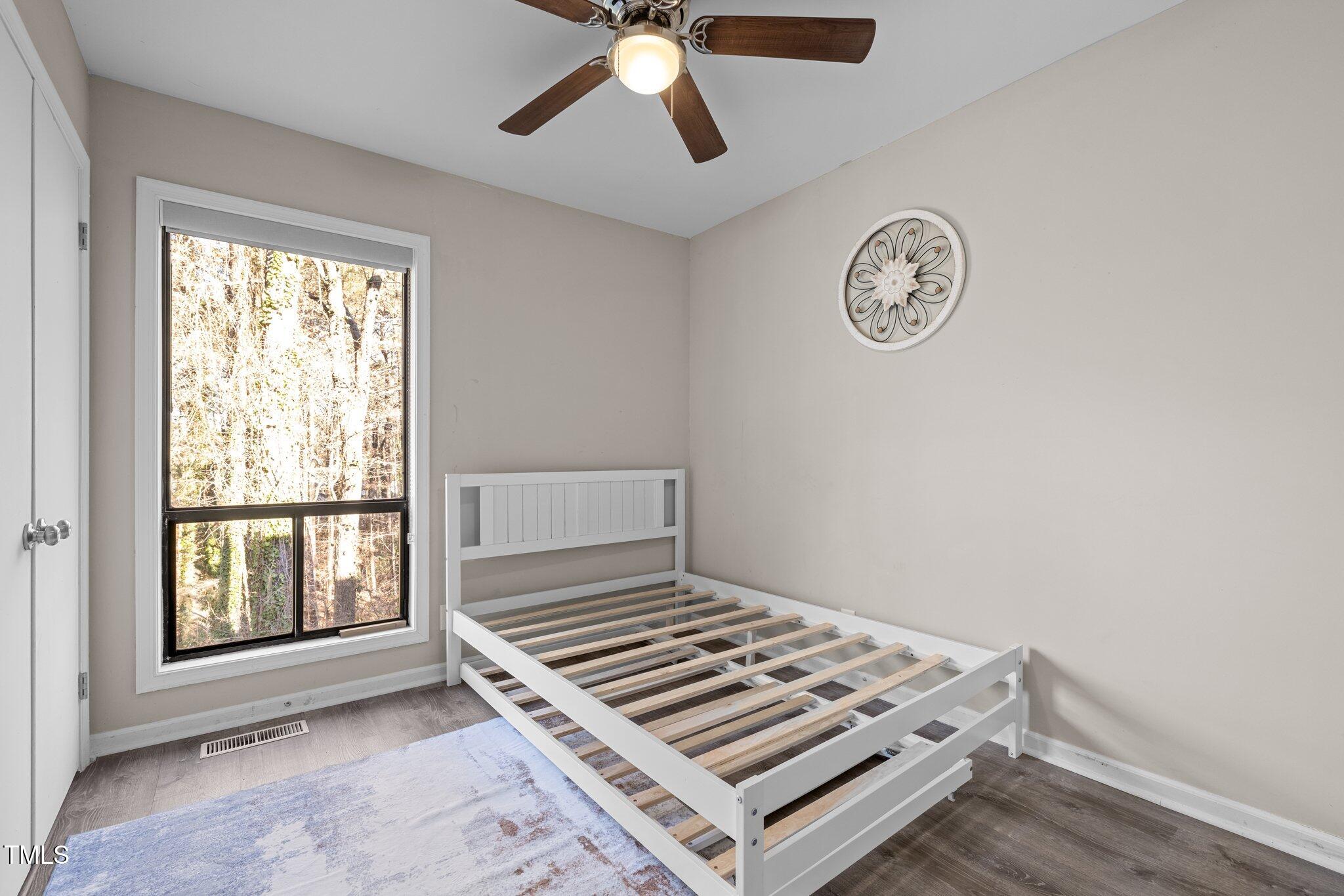 6230 Dixon Drive Raleigh, NC 27609 - Photo 20 of 32 a view of an empty room with a window
