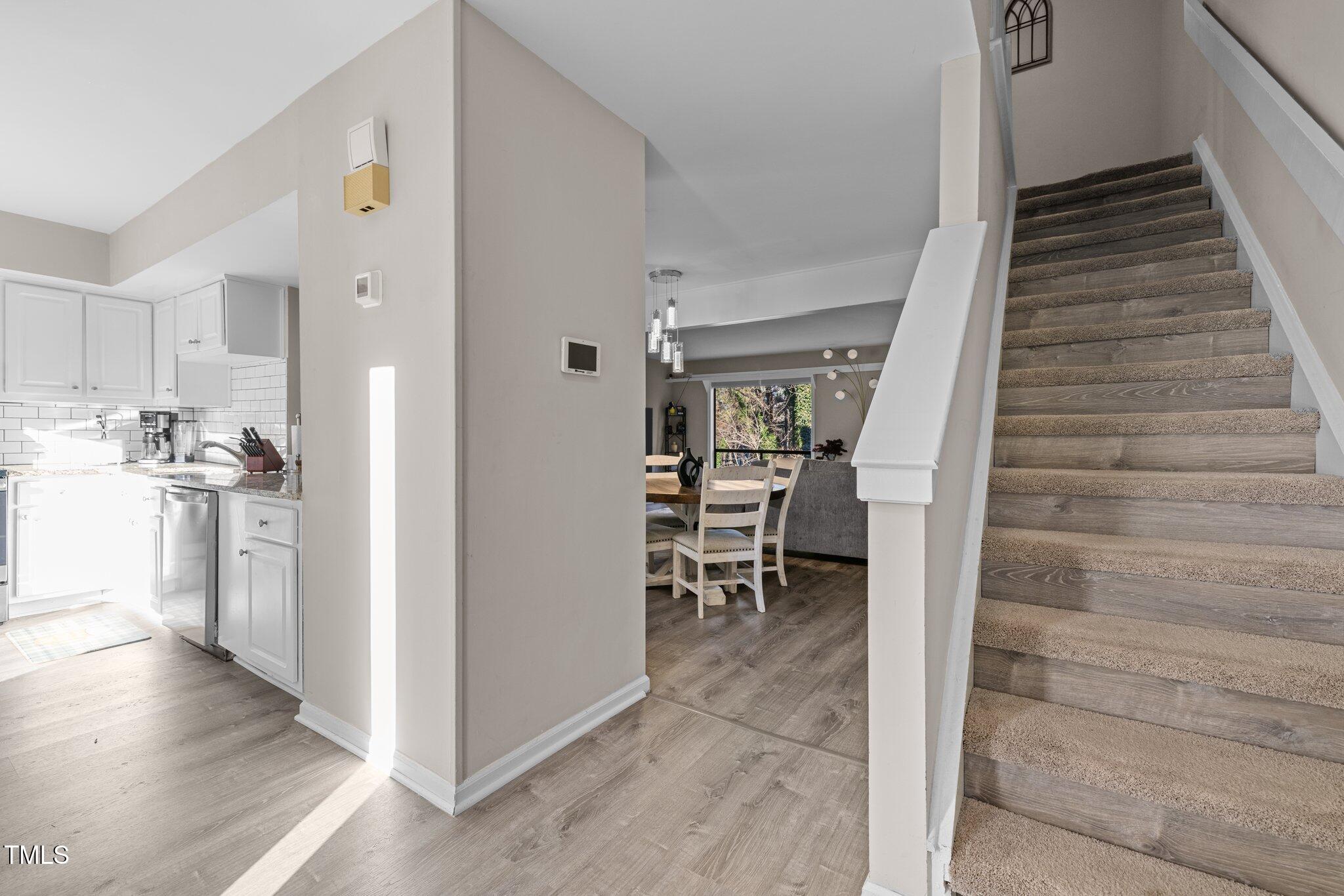 6230 Dixon Drive Raleigh, NC 27609 - Photo 2 of 32 a view of entryway and kitchen