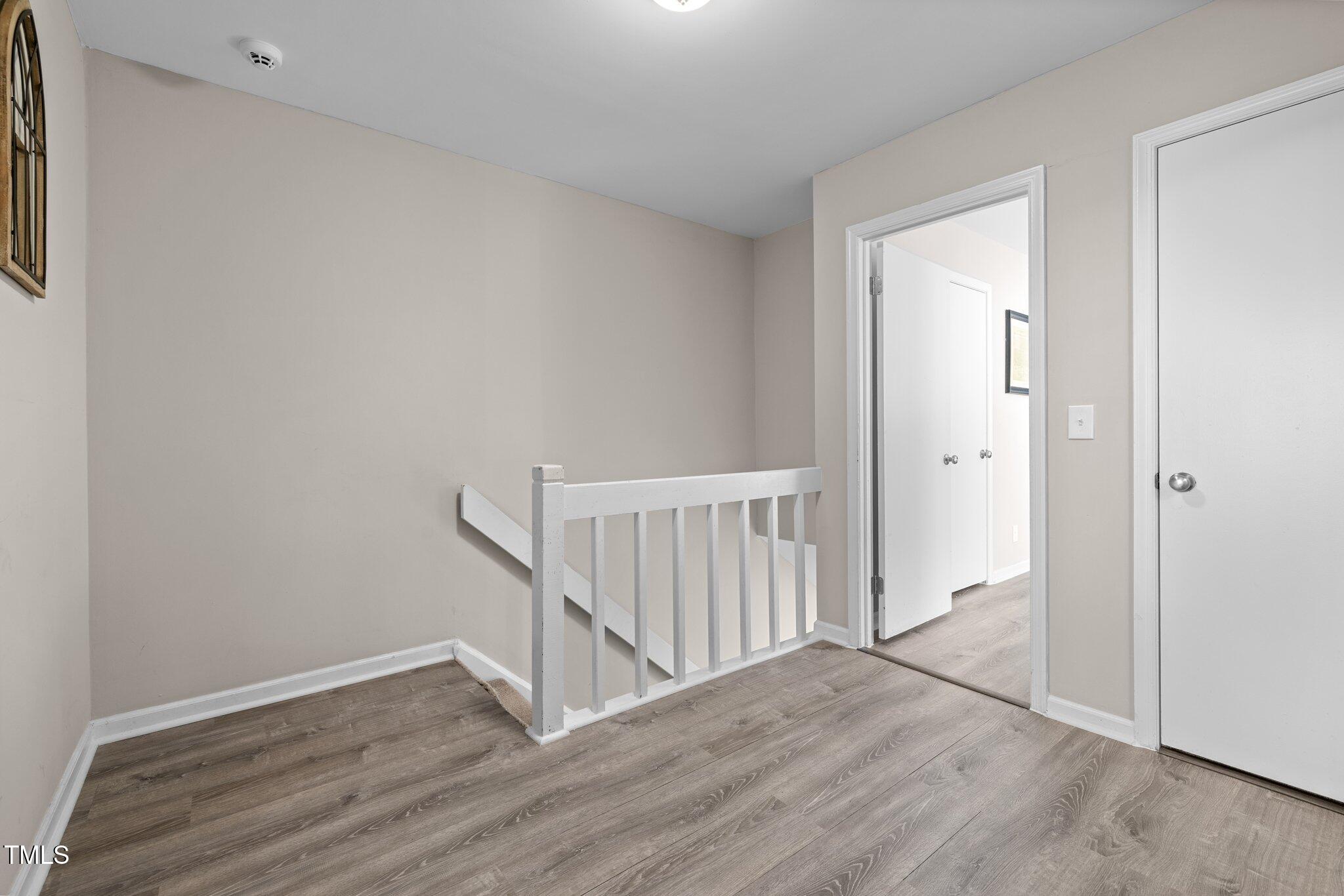 6230 Dixon Drive Raleigh, NC 27609 - Photo 21 of 32 a view of entryway with wooden floor