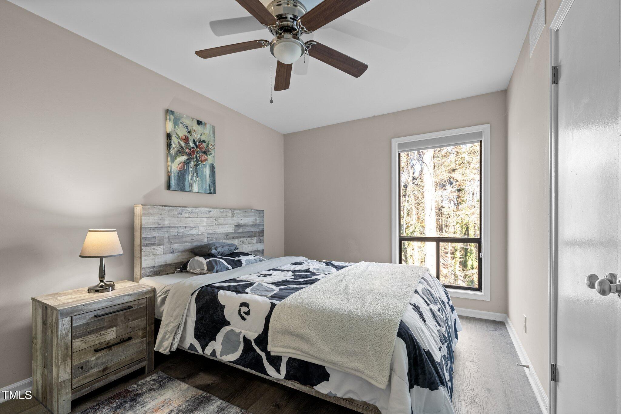 6230 Dixon Drive Raleigh, NC 27609 - Photo 26 of 32 a bedroom with a bed and a window