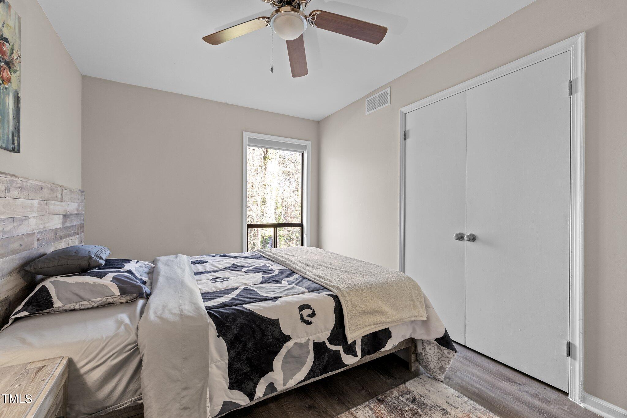 6230 Dixon Drive Raleigh, NC 27609 - Photo 27 of 32 a bedroom with a bed and a window