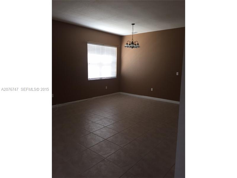 2145 Northeast 38th Road Homestead, FL 33033 - Photo 12 of 28 a view of an empty room with a window