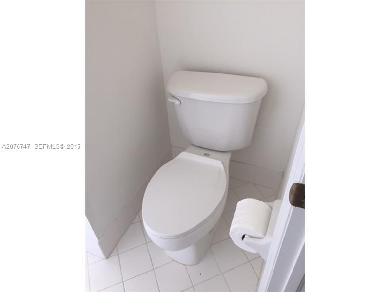2145 Northeast 38th Road Homestead, FL 33033 - Photo 25 of 28 a close view of a toilet in a bathroom