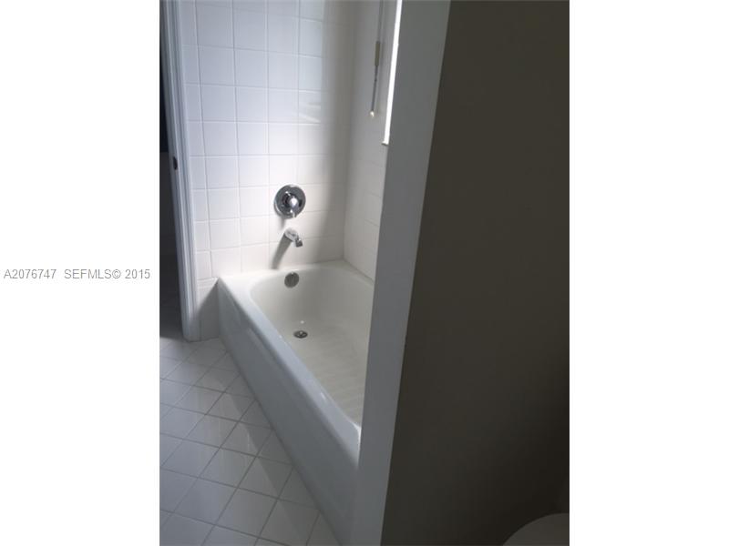 2145 Northeast 38th Road Homestead, FL 33033 - Photo 26 of 28 a bathroom with a bathtub