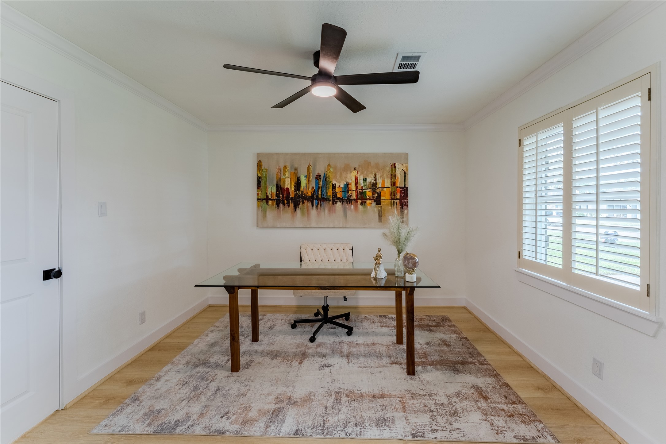 6027 Valkeith Drive Houston, TX 77096 - Photo 17 of 31 a view of a work space with wooden floor and a window