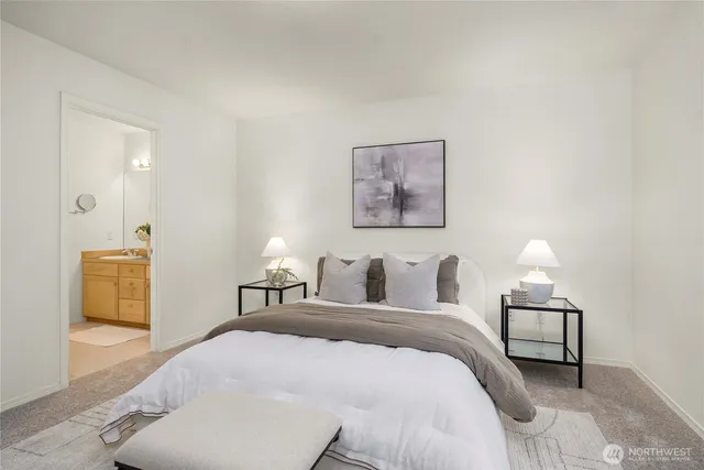 a bedroom with a bed and a lamp