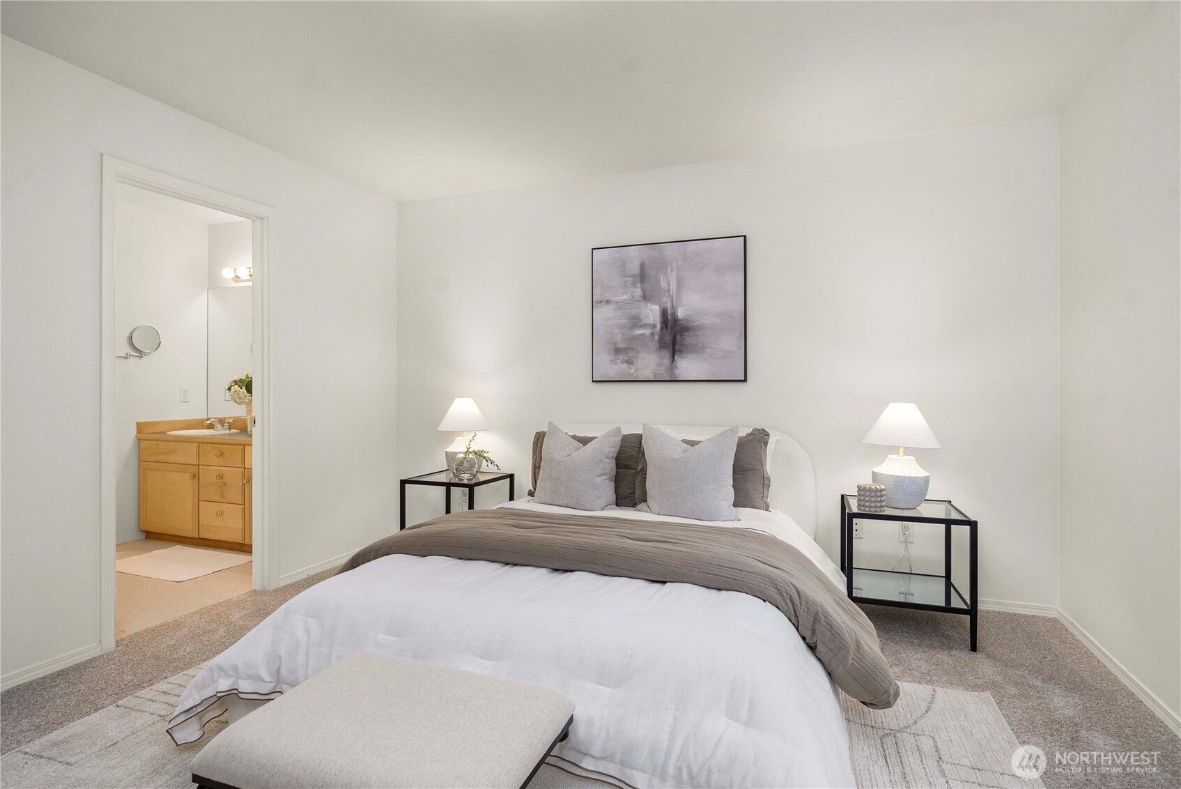 19504 Southeast 24th, Unit B Bothell, WA 98012 - Photo 16 of 34 a bedroom with a bed and a lamp