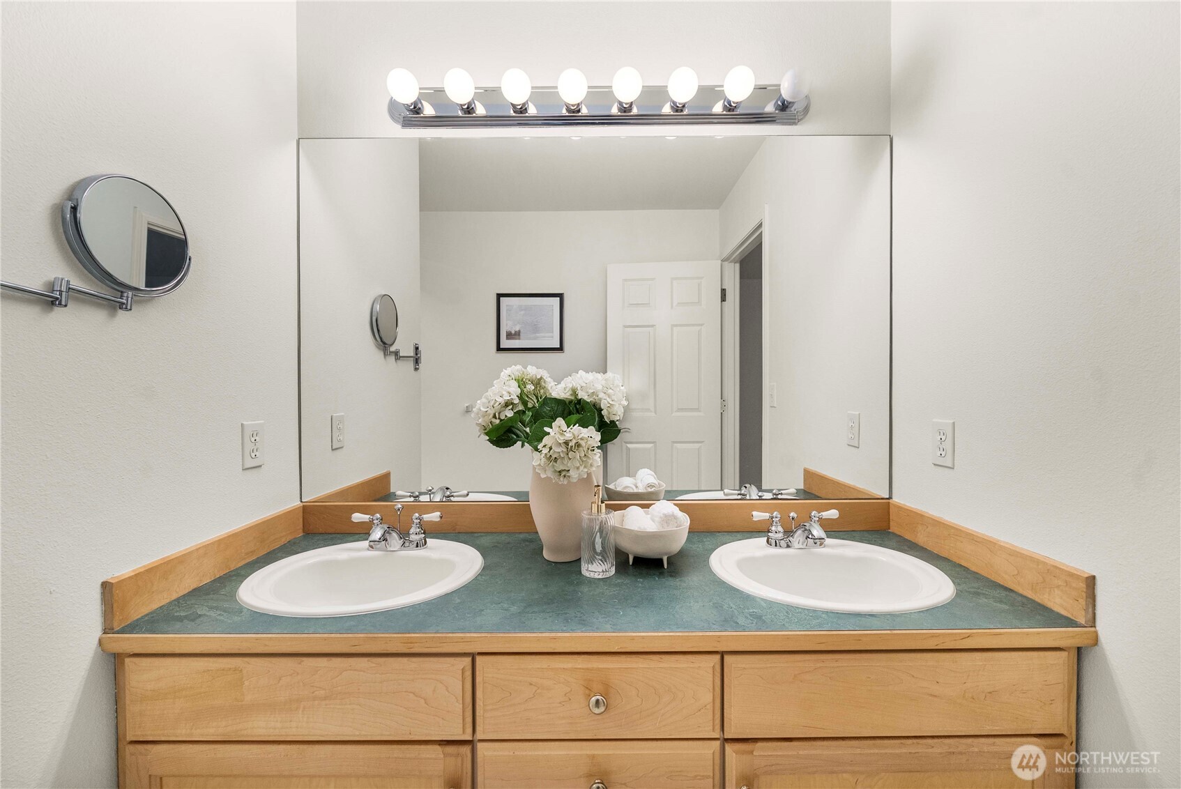 19504 Southeast 24th, Unit B Bothell, WA 98012 - Photo 19 of 34 a bathroom with a sink and a mirror