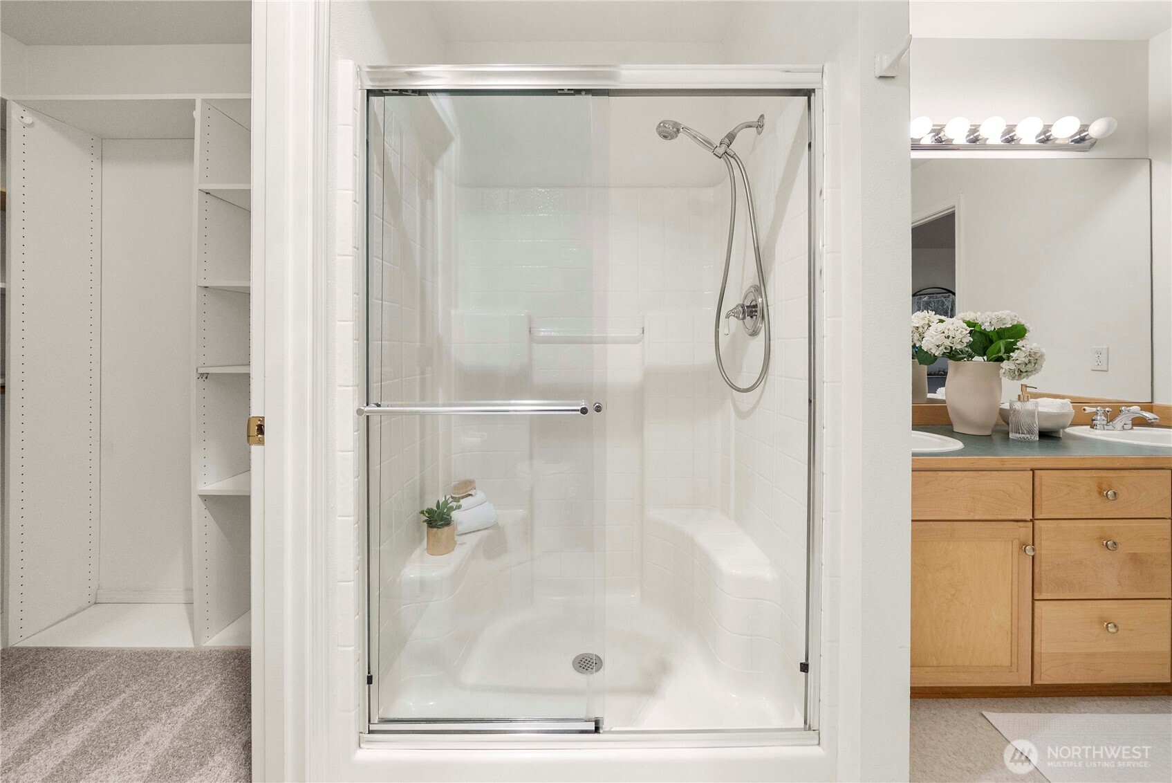19504 Southeast 24th, Unit B Bothell, WA 98012 - Photo 20 of 34 a bathroom with a glass shower door and a sink