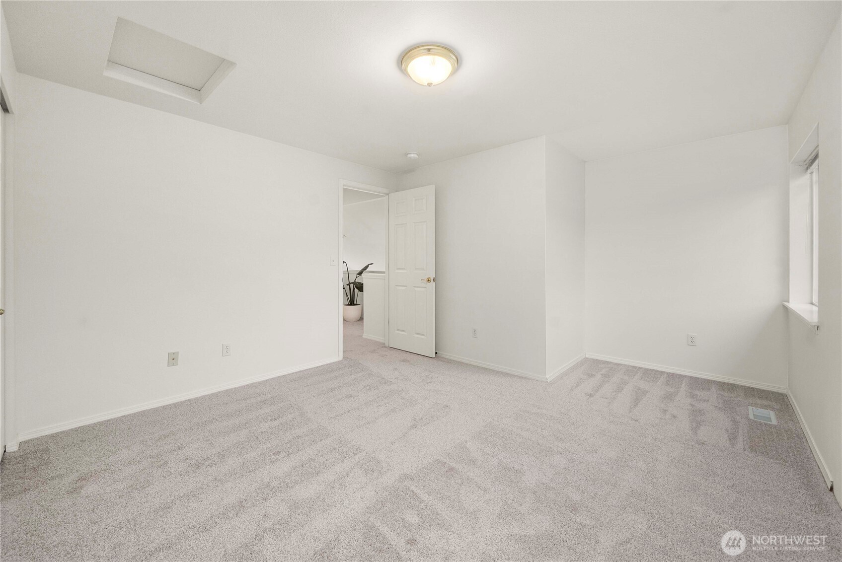 19504 Southeast 24th, Unit B Bothell, WA 98012 - Photo 26 of 34 an empty room with a empty space and a window