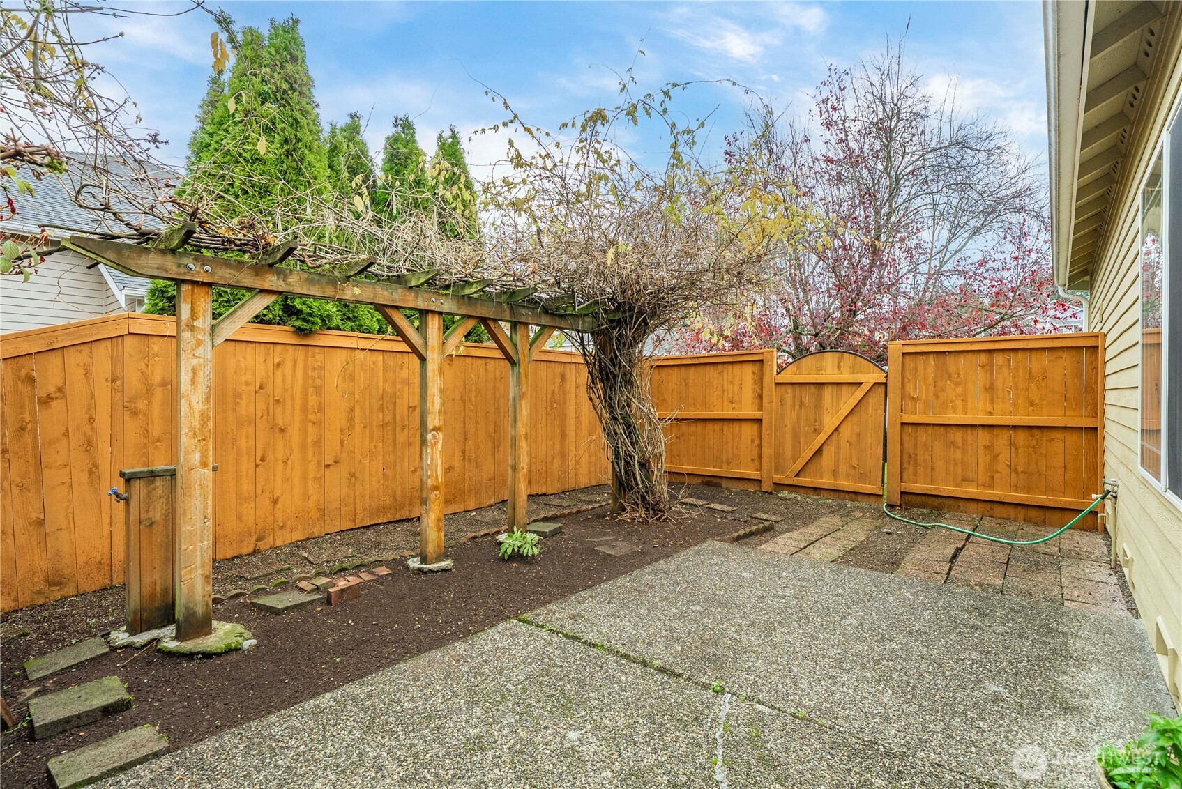 19504 Southeast 24th, Unit B Bothell, WA 98012 - Photo 28 of 34 a view of a backyard
