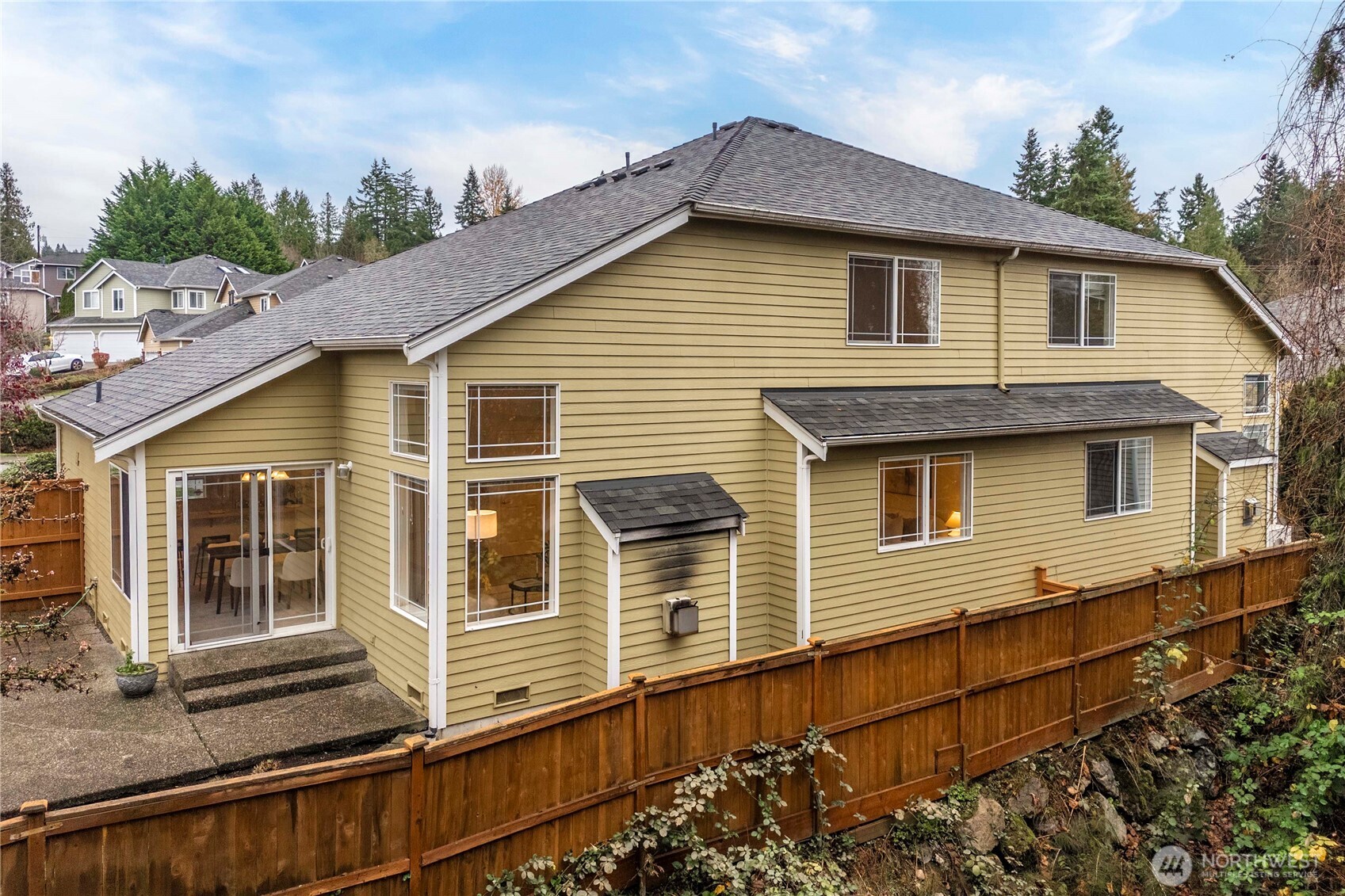 19504 Southeast 24th, Unit B Bothell, WA 98012 - Photo 29 of 34 a front view of a house with windows