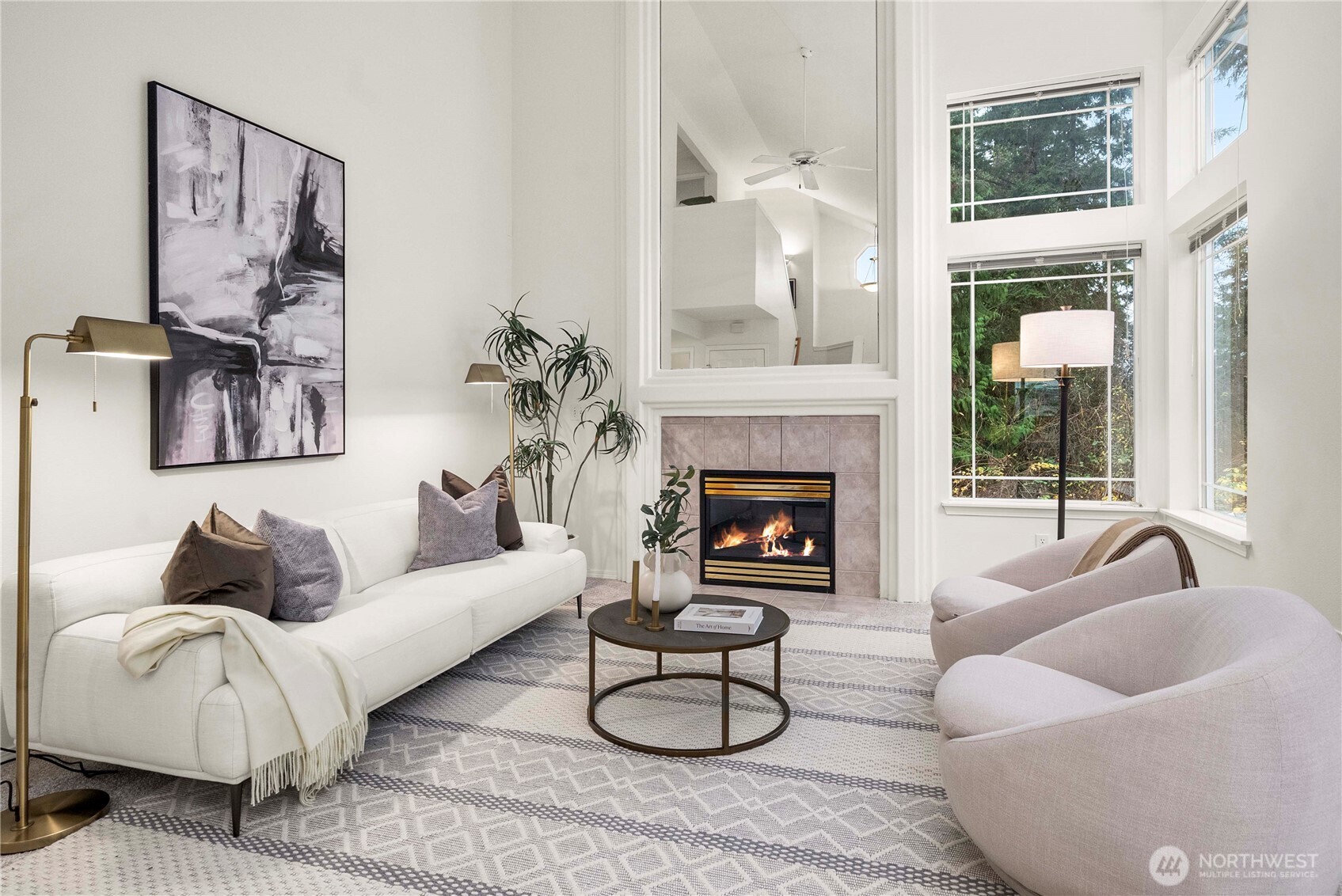 19504 Southeast 24th, Unit B Bothell, WA 98012 - Photo 3 of 34 a living room with furniture and a fireplace