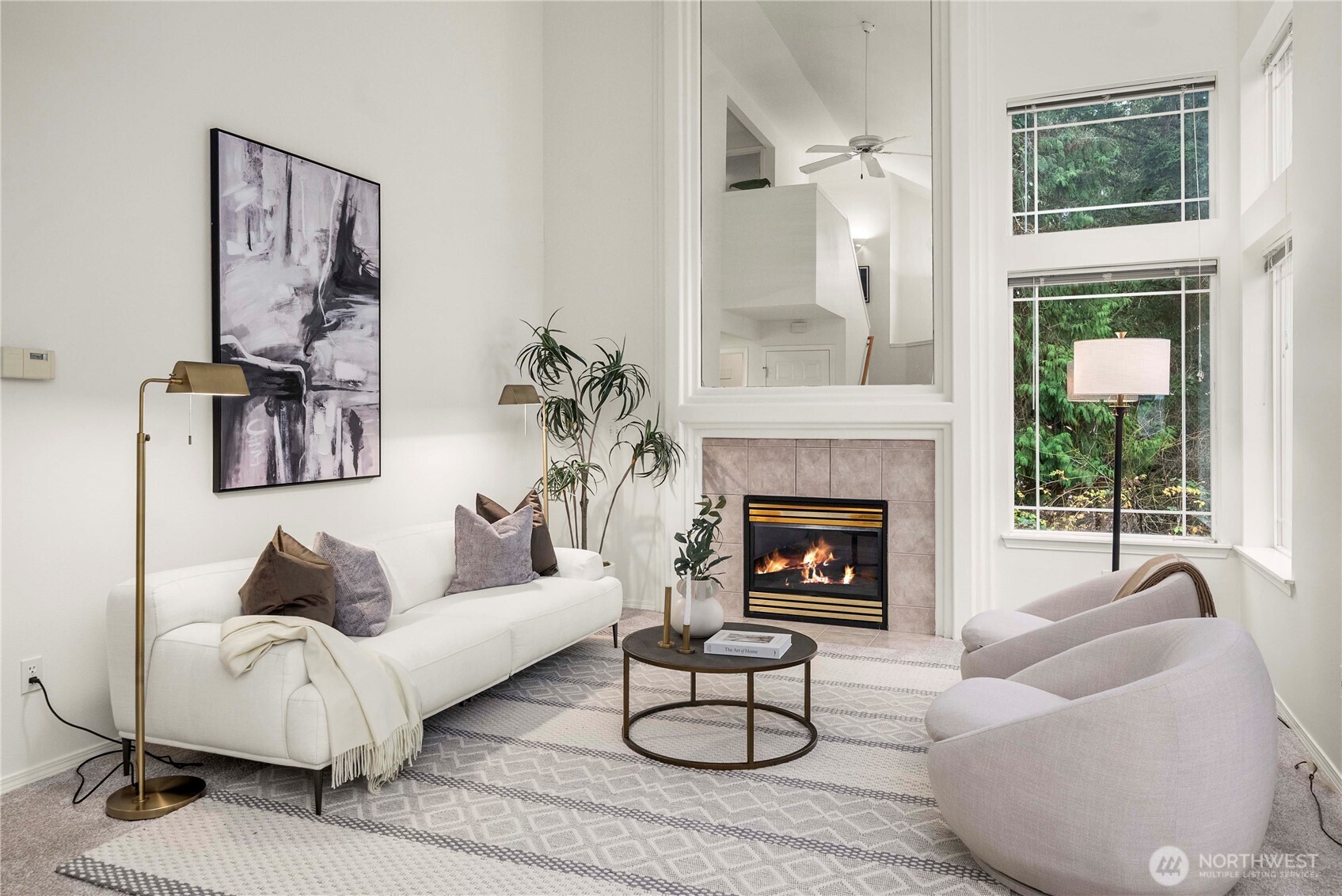 19504 Southeast 24th, Unit B Bothell, WA 98012 - Photo 4 of 34 a living room with furniture a fireplace and a large window