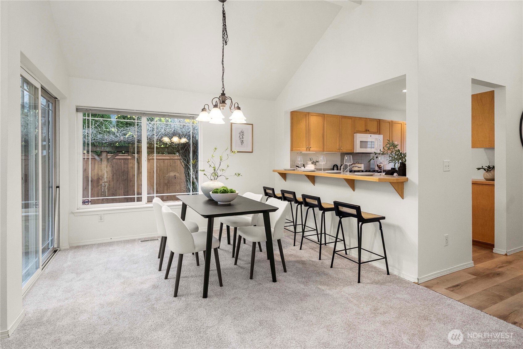 19504 Southeast 24th, Unit B Bothell, WA 98012 - Photo 7 of 34 a view of a dining room with furniture window and outside view