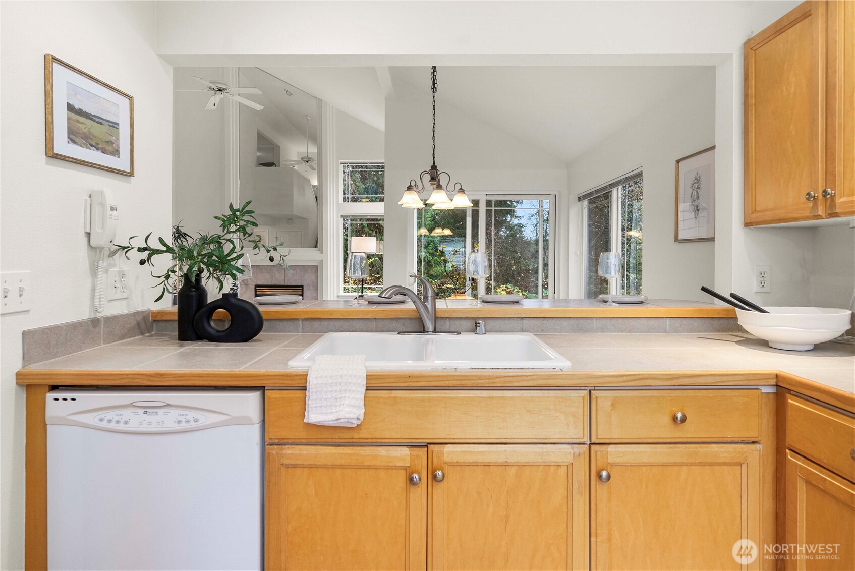 19504 Southeast 24th, Unit B Bothell, WA 98012 - Photo 8 of 34 a kitchen with a sink and a potted plant