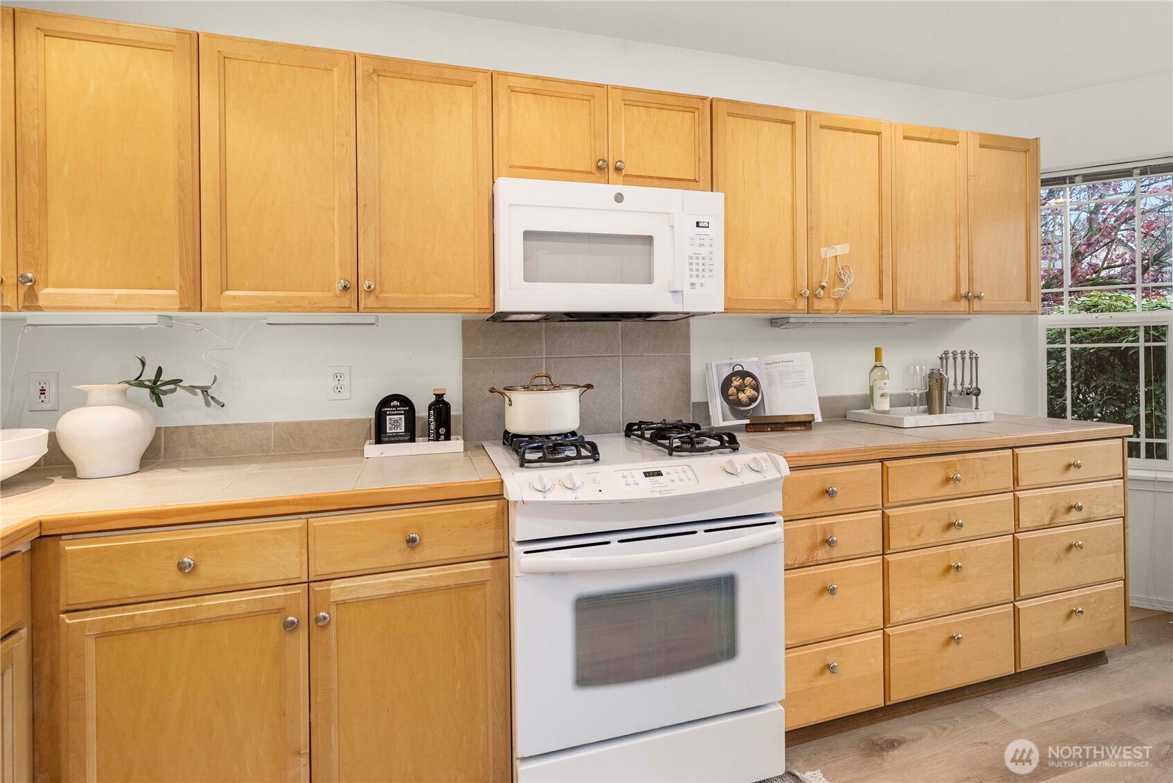19504 Southeast 24th, Unit B Bothell, WA 98012 - Photo 9 of 34 a kitchen with appliances cabinets and a sink