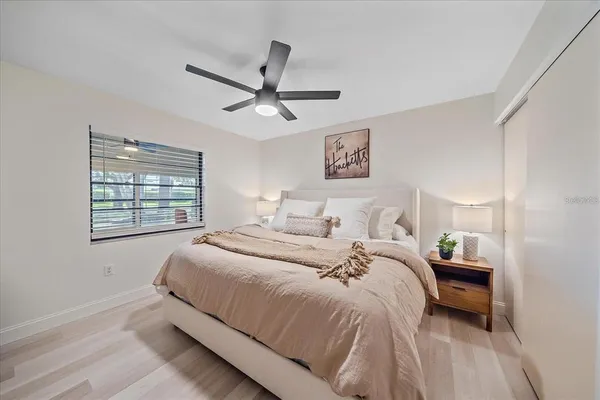 a bedroom with a bed and a window