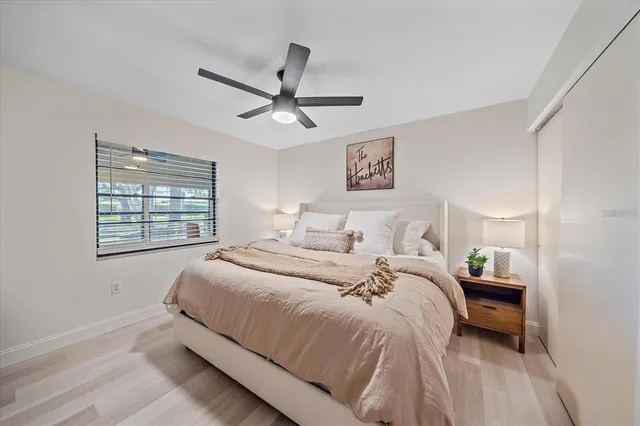 a bedroom with a bed and a window