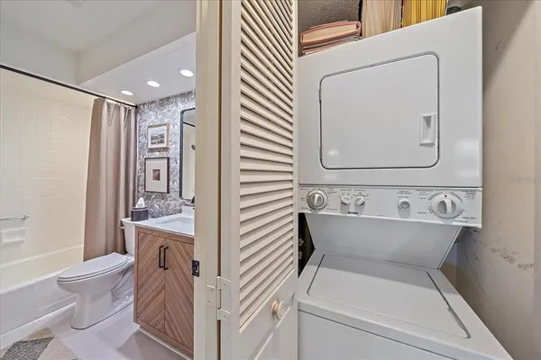 a bathroom with a sink a toilet and a bathtub