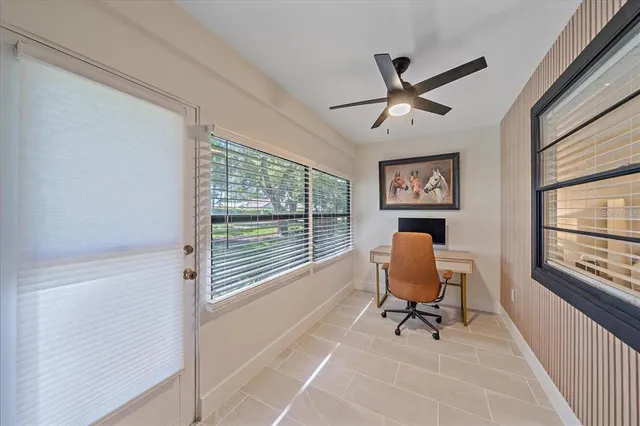 a work room with furniture and windows