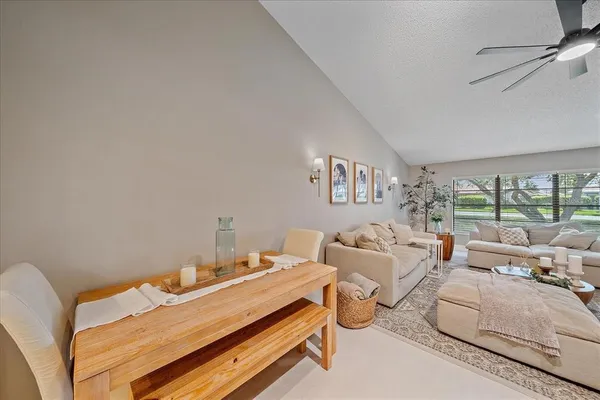 a bedroom with furniture and a large window